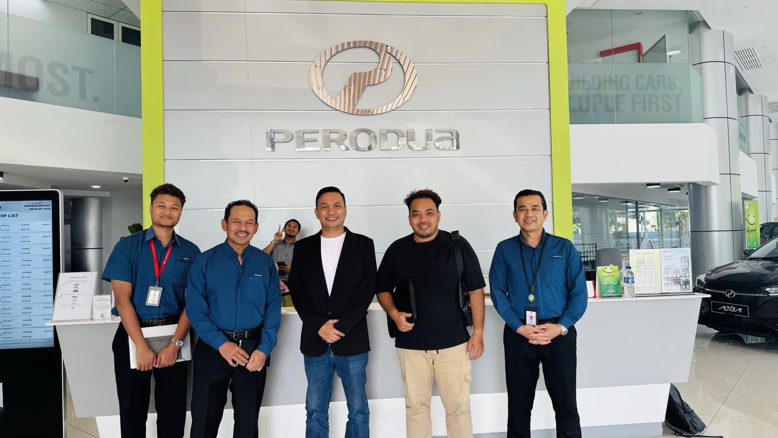 The MCL team at a Perodua showroom