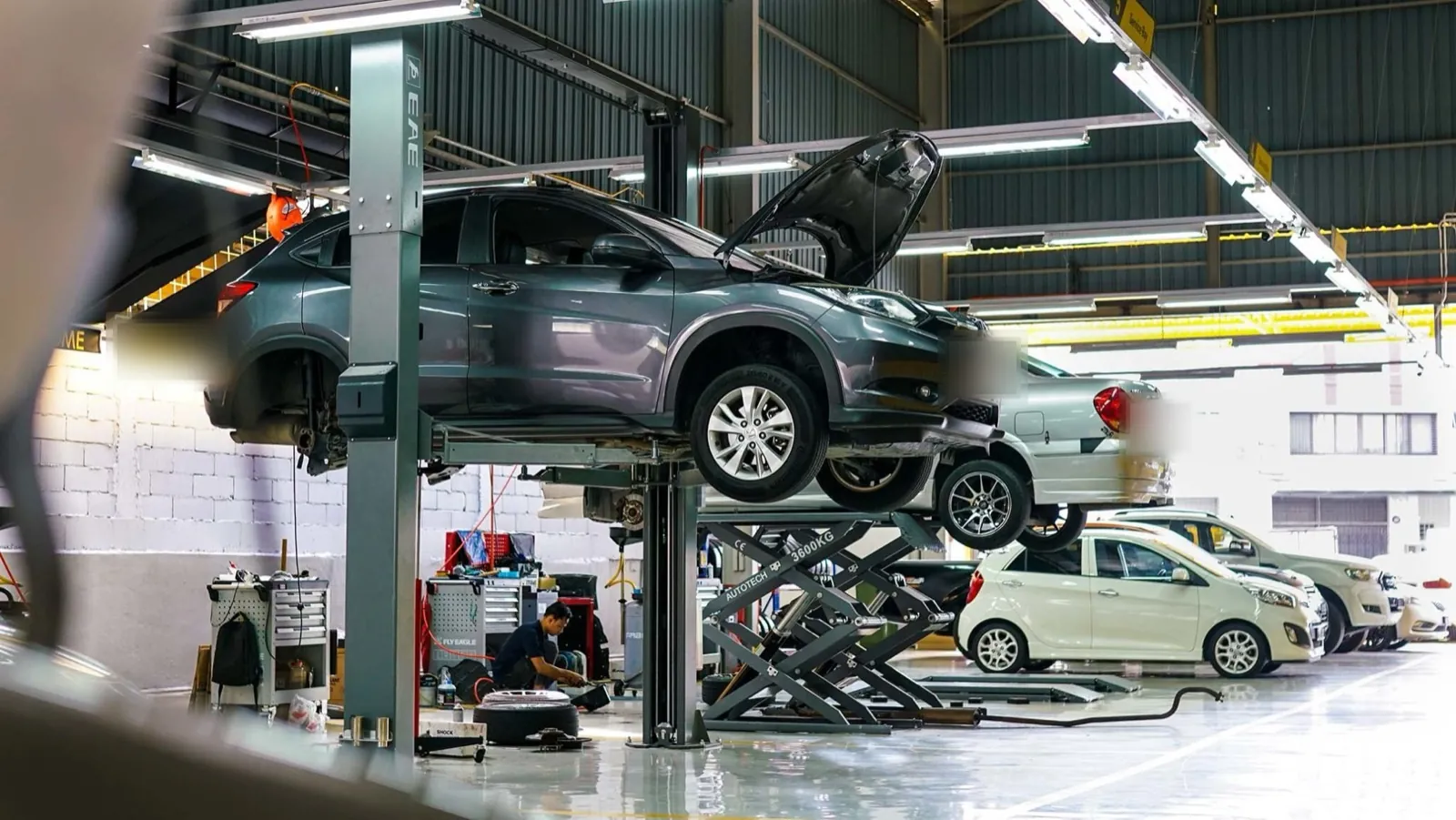 Cars on the lifts at the MCL workshop